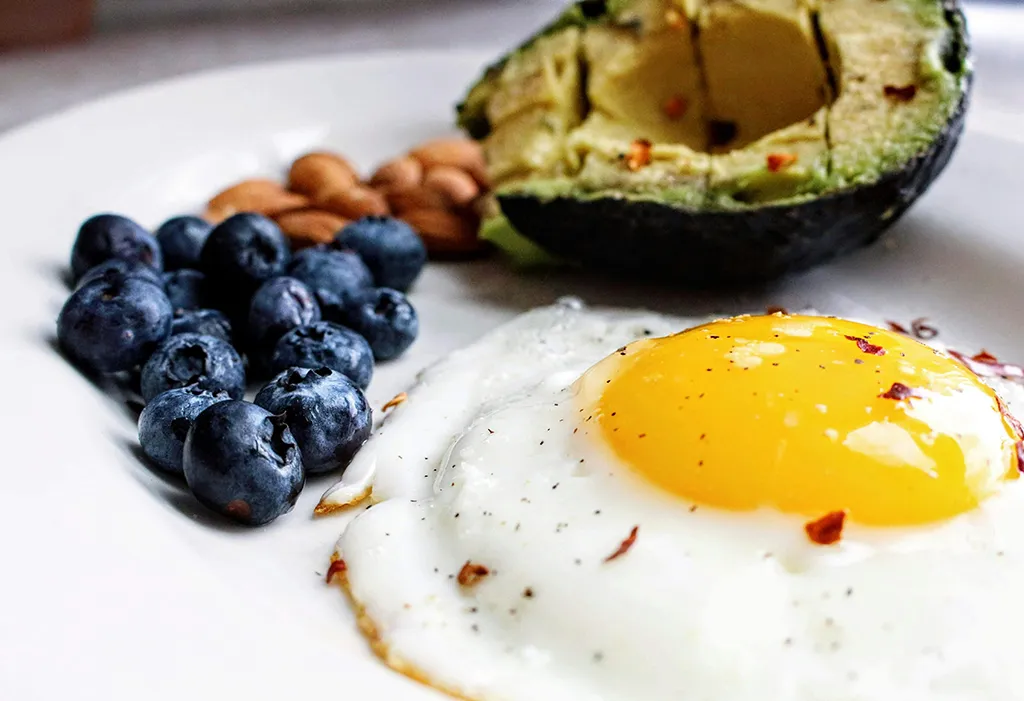 Keto food with avocado, eggs and fish