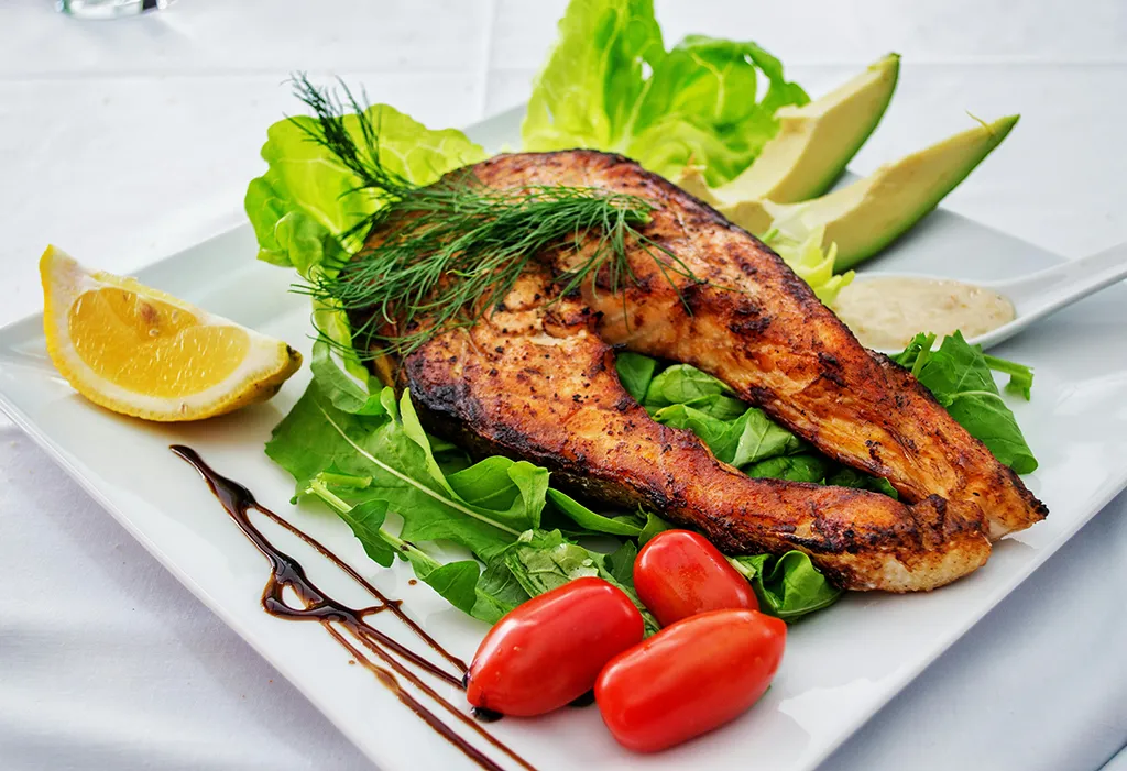 Mediterranean food with vegetables, fish and olive oil