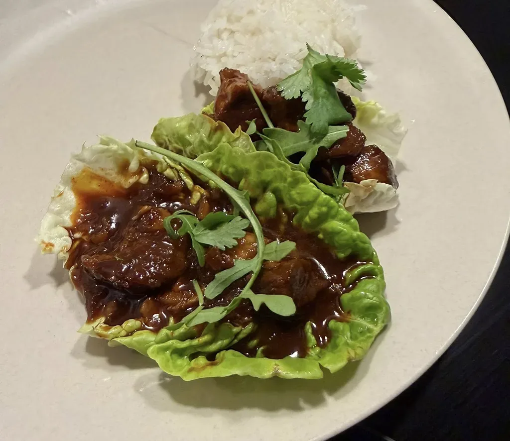 Korean pulled pork in lettuce wraps with chili and sesame